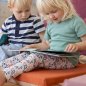 Preview: Kinder auf der Spielmatte orange